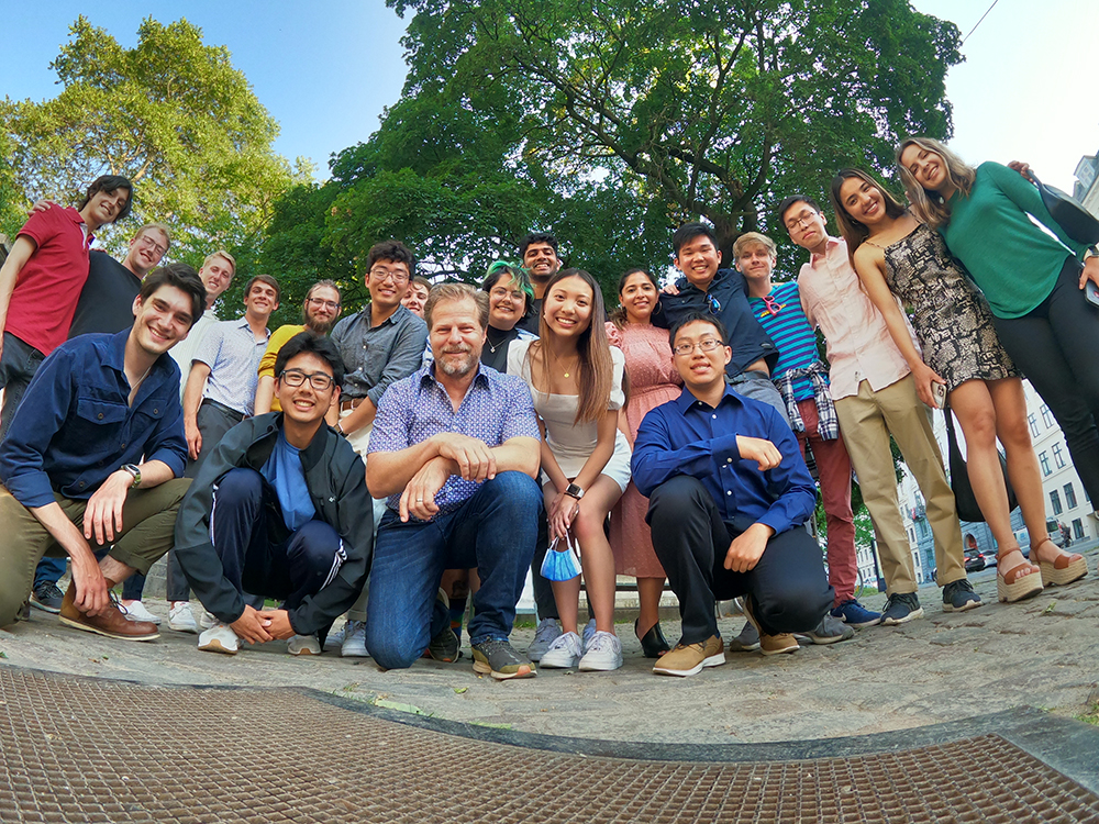 Large group posing for photo outside