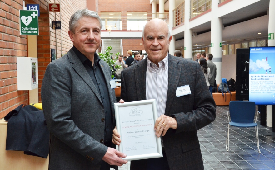 Texas Engineer Thomas Edgar holding award