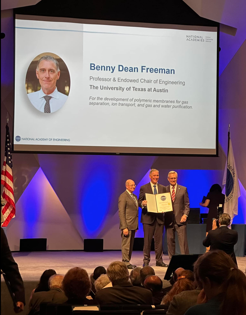 Benny Freeman standing onstage at NAE ceremony