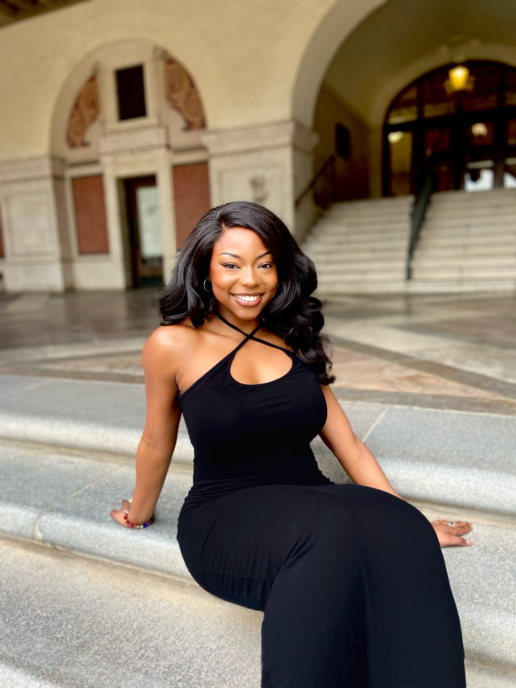Texas ChE student Tayler Edwards sitting on steps