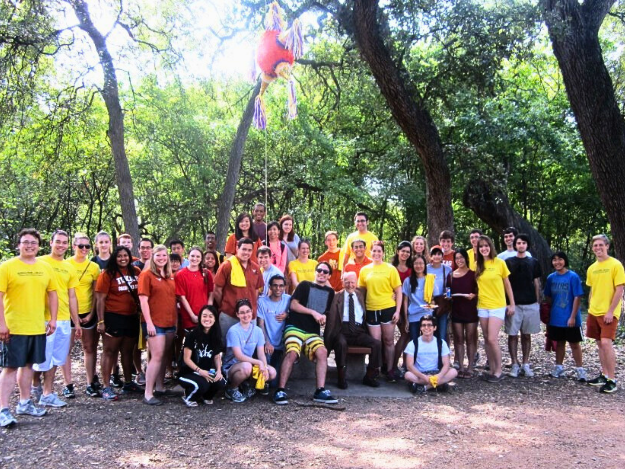 Group of Chemical Engineering alumni and students smiling with John McKetta at the 2012 McKetta Picnic