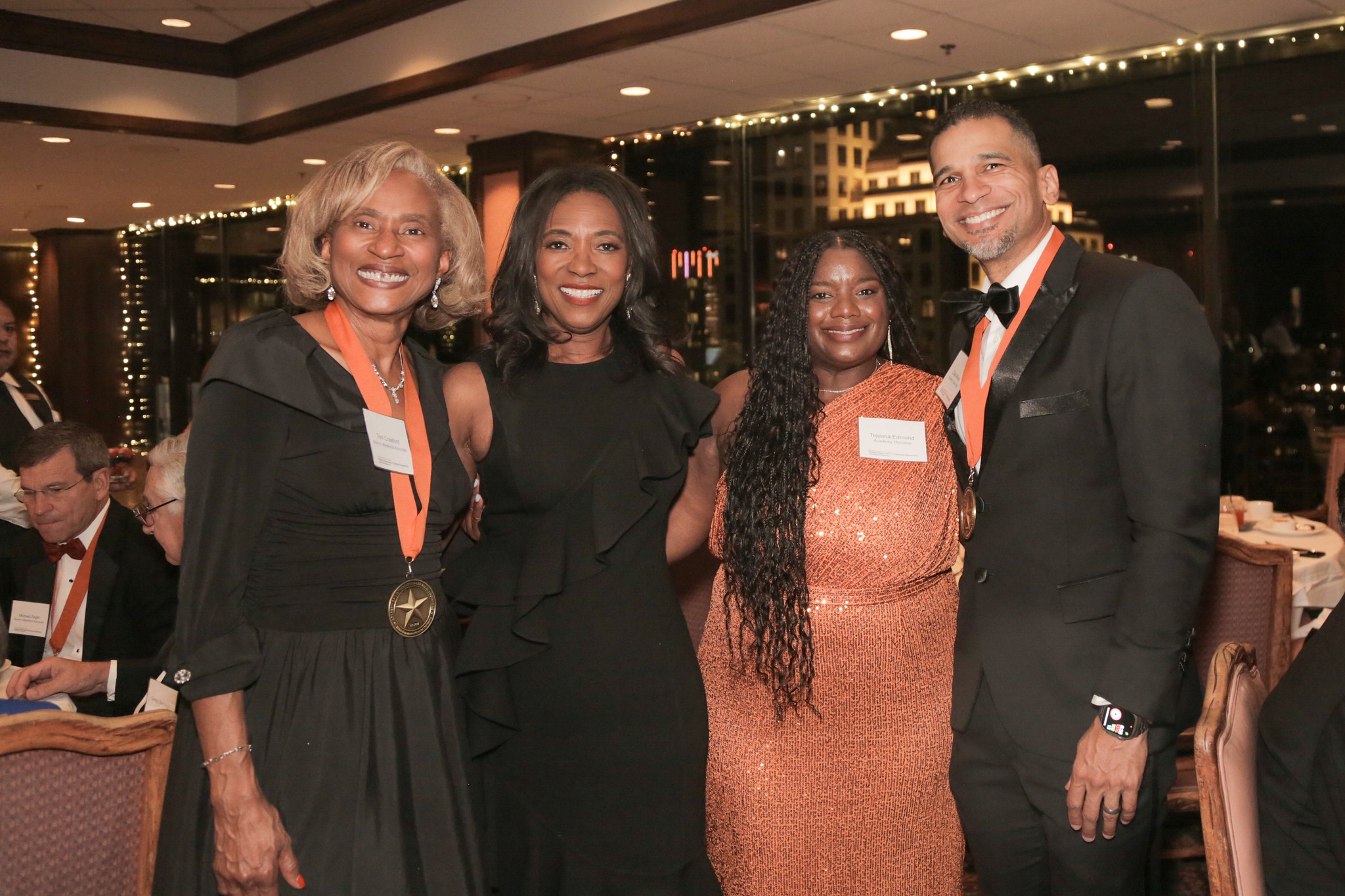 Texas ChE alumni smiling for a photo in formal wear