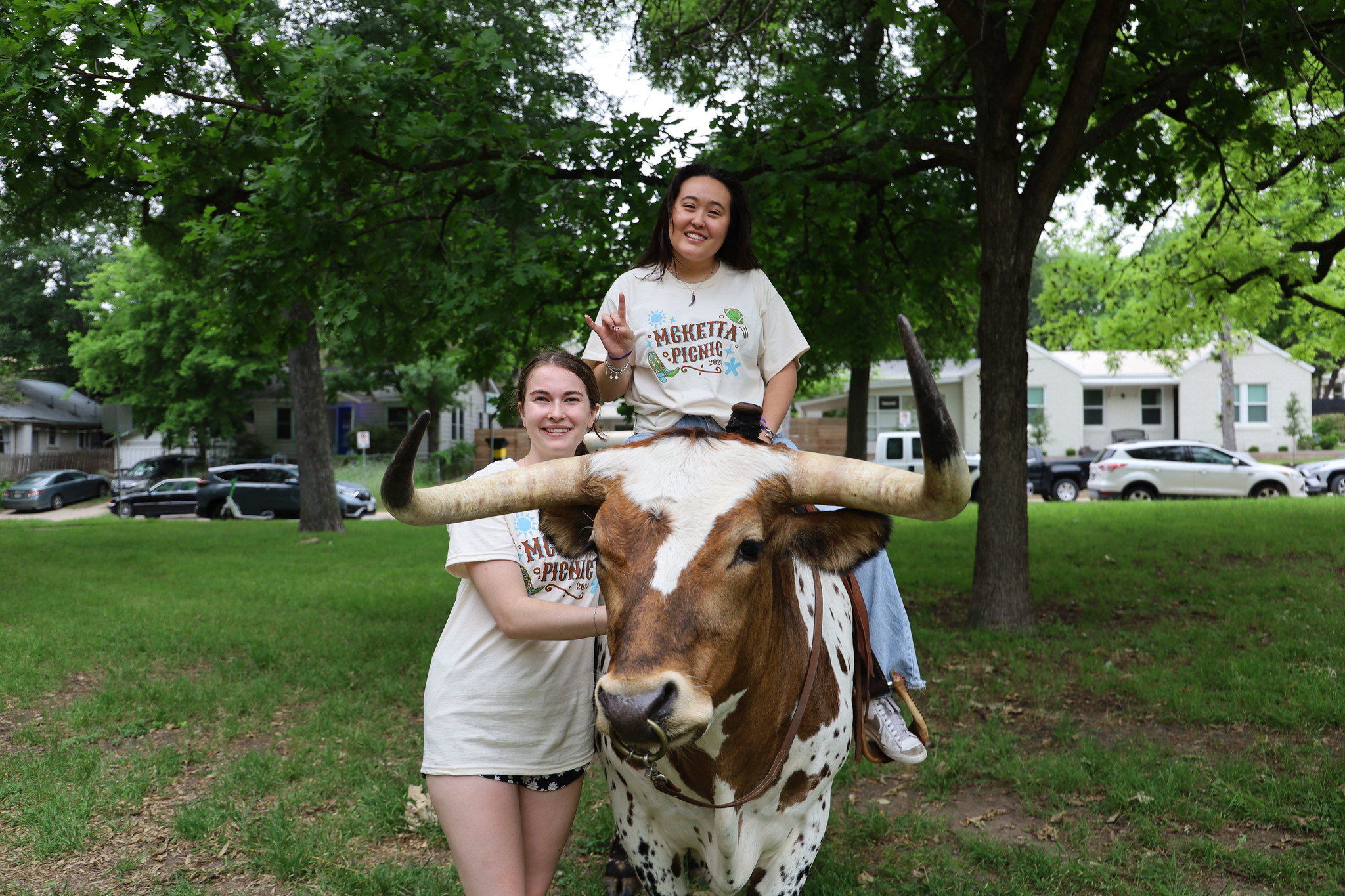 Texas Engineering students riding Longhorn and smiling
